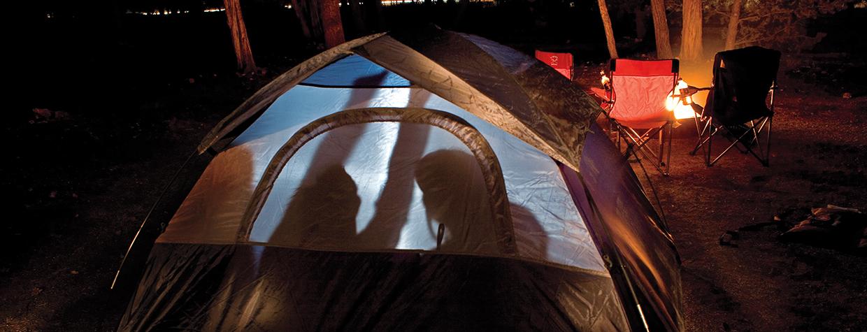 Four Canyon novices huddle inside their tent during a cold night at Mather Campground on the Grand Canyon’s South Rim. By Peter Schwepker