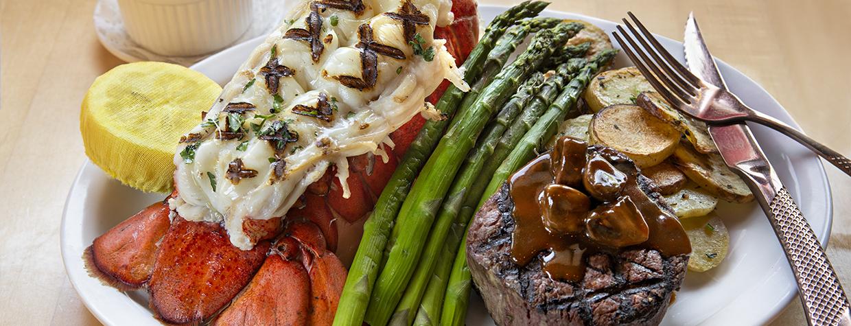 Photograph of lobster tail and steak with asparagus at The Copper Note is by Karen Shell