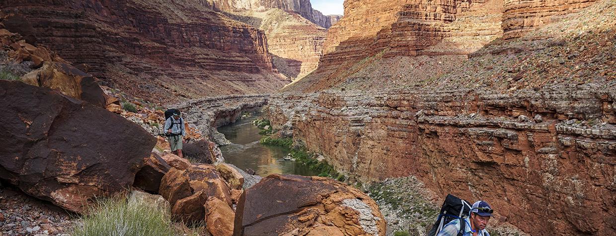 On the fifth day of the trip, author Kevin Fedarko (left) and photographer Pete McBride traverse a stretch of terrain across from 29 Mile Canyon. | RICH RUDOW