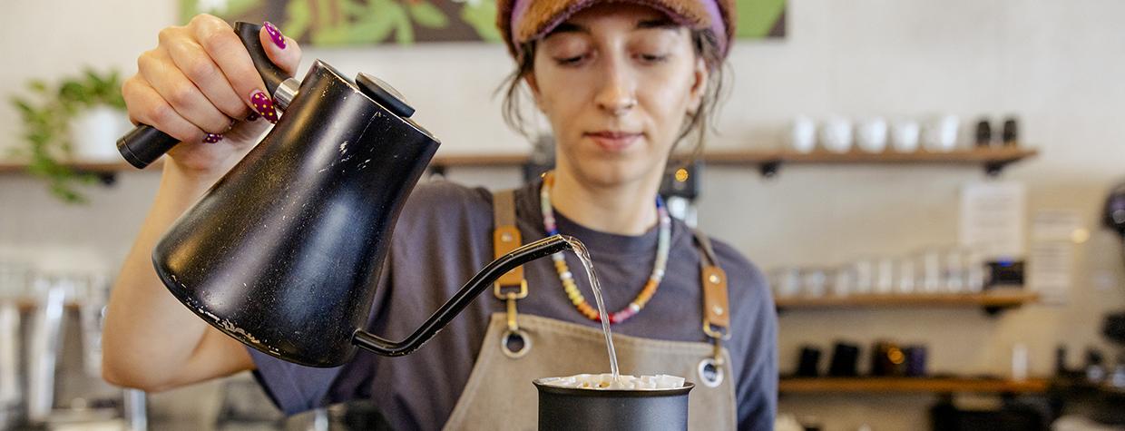 Barista Linnea Renken prepares a pour-over coffee at Peixoto’s Chandler location. | Jill Richards