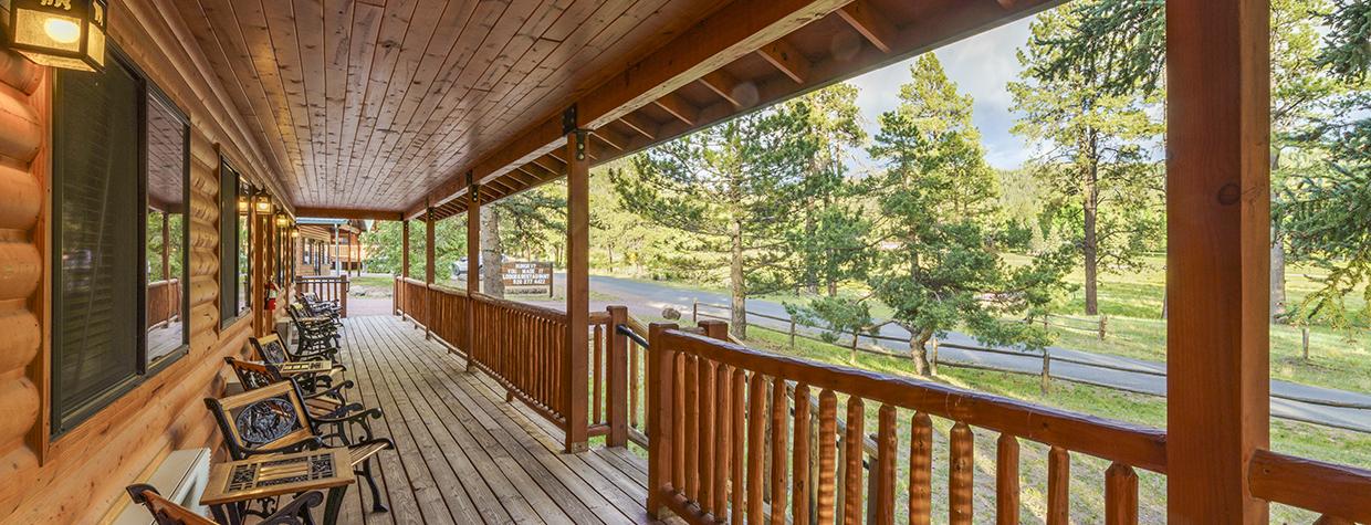 The long, wooden porch at Tal-Wi-Wi has plenty of chairs for guests to enjoy the White Mountains view. By Laurence Parent