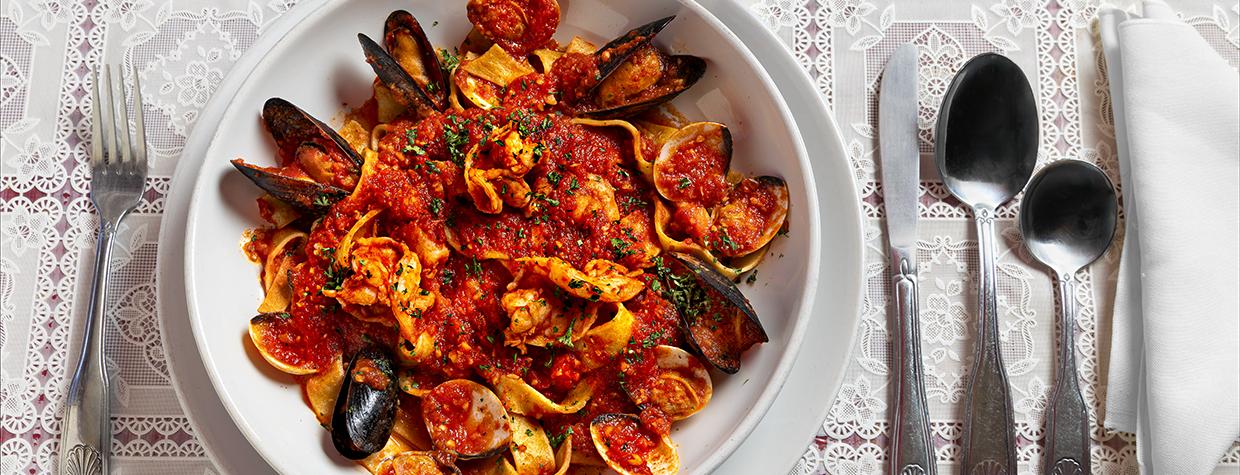 Pasta pescatore, topped with scallops, calamari, shrimp, clams, mussels and a homemade red sauce. | Steven Meckler