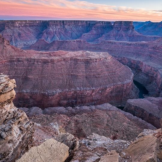 The Colorado River flows through Marble Canyon at sunset in a view from Buck Farm Viewpoint. | Gary Ladd