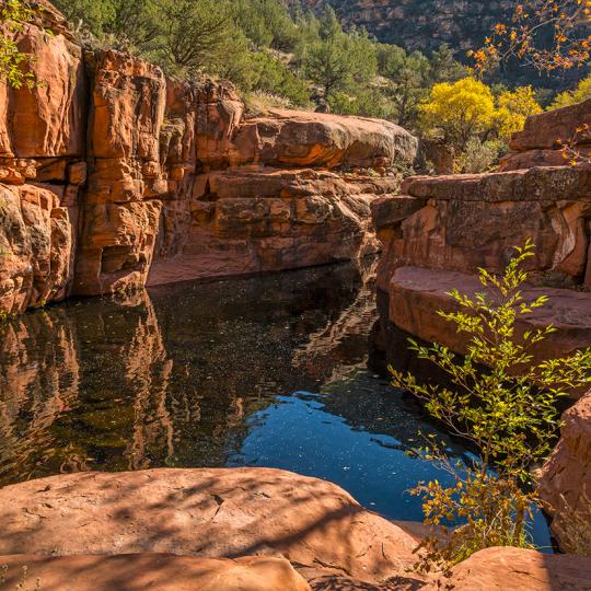 Fall color surrounds Wet Beaver Creek’s “The Crack,” a highlight of the Bell Trail. By Laurence Parent