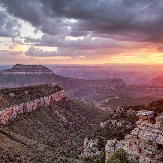 Steamboat Mountain dominates a sunset view of the Grand Canyon from the North Rim’s Locust Point. By Doug Koepsel