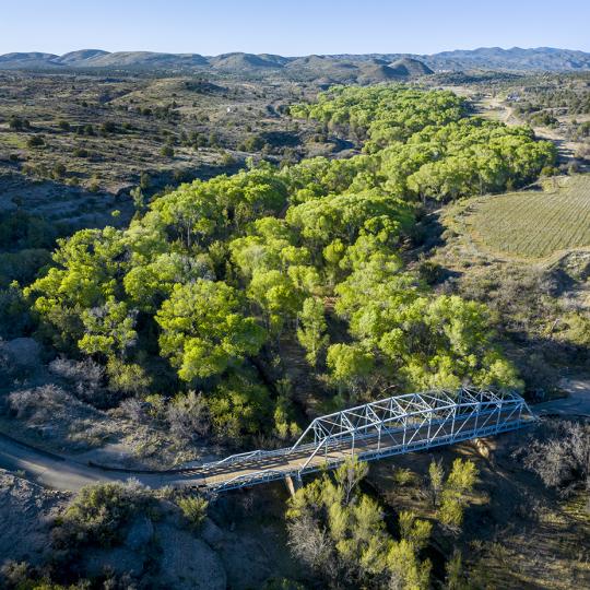 A historic bridge on Wagoner Road spans the cottonwood-lined Hassayampa River. By Rebecca Wilks