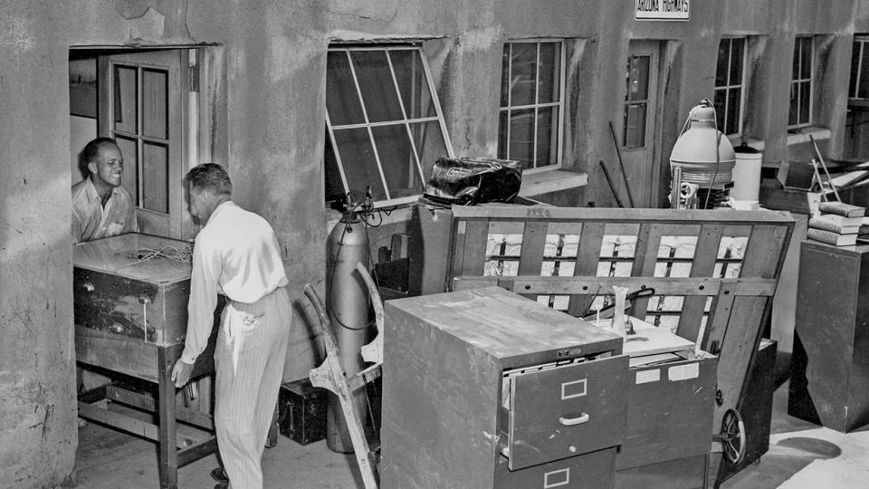 Raymond Carlson (left) helps move furniture from our first office.