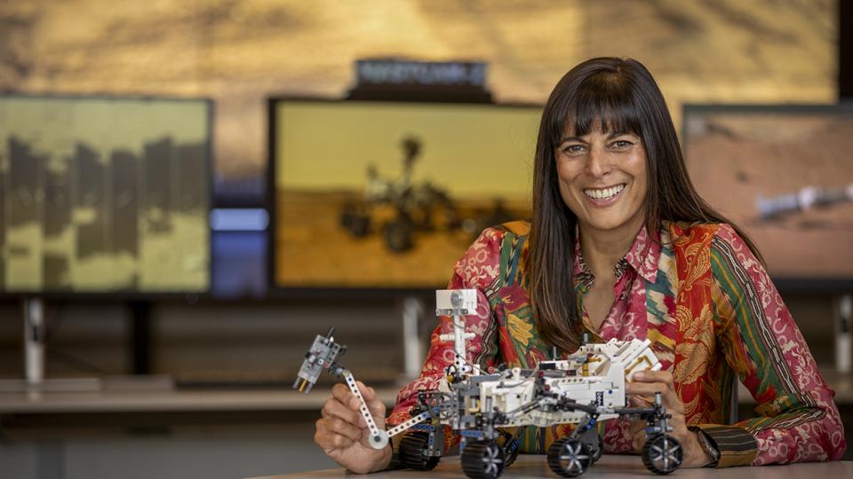 Meenakshi Wadhwa poses with a scaled down model of an extraterrestrial land rover. By Paul Markow