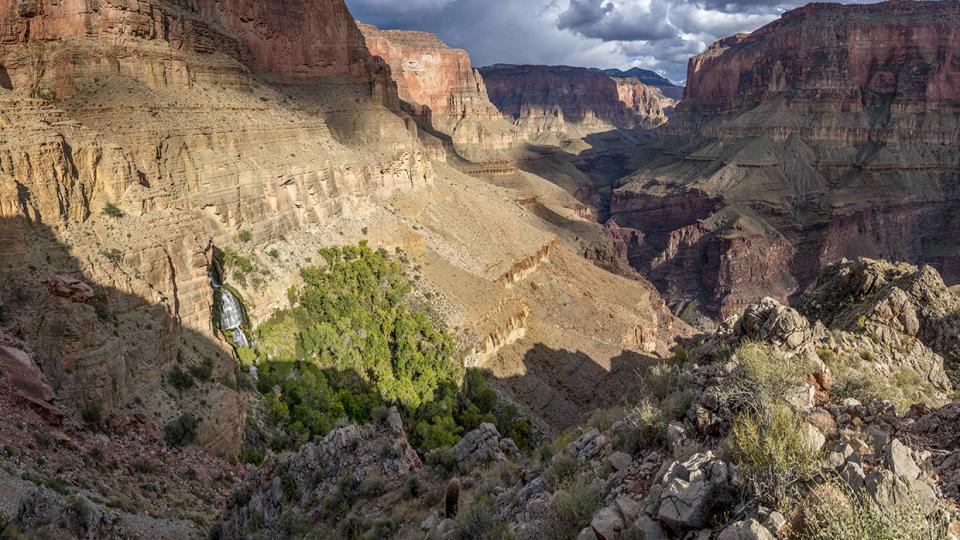 Thunder River Falls pours from an opening in a steep cliff in the Grand Canyon. From here, the Thunder River — referred to in this story as Thunder Creek — flows for only half a mile to its intersection with Tapeats Creek, making it one of the world’s shortest rivers. By Rich Rudow