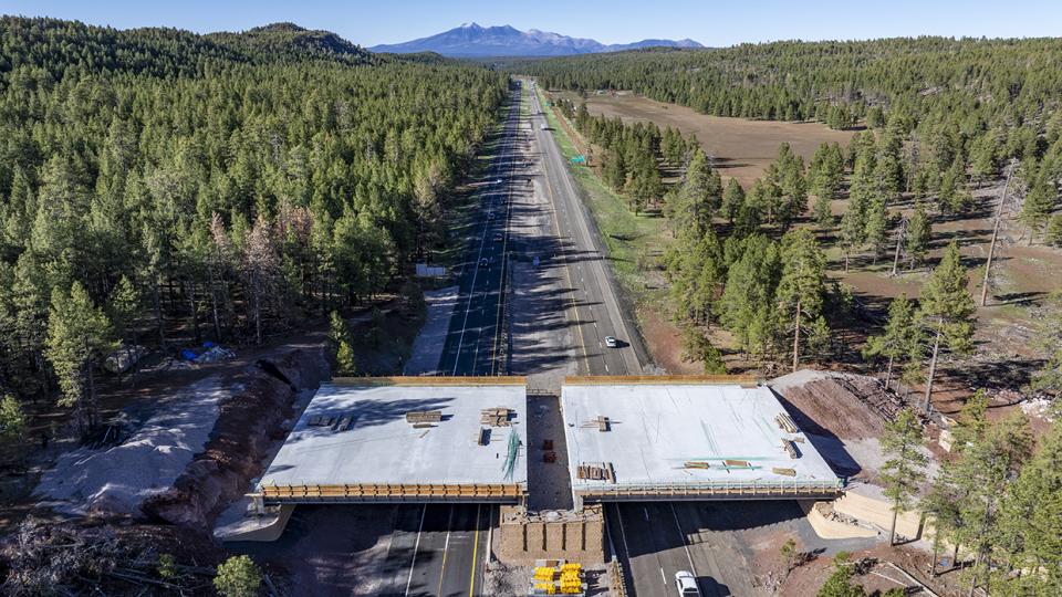 This photograph, made with a drone, shows a new wildlife bridge under construction over Interstate 17 between Munds Park and Flagstaff. | LAURENCE PARENT