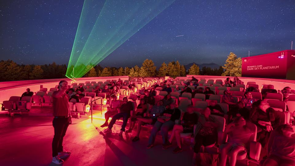 A presenter guides visitors on a tour of the night sky at Lowell Observatory. By Dawn Kish