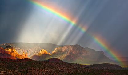 Falling rain and a rainbow bring a dreamlike vibe to a view of Red Rock Country. Such otherworldly views may be part of the reason the Sedona area has become a destination for those seeking paranormal experiences. | Guy Schmickle