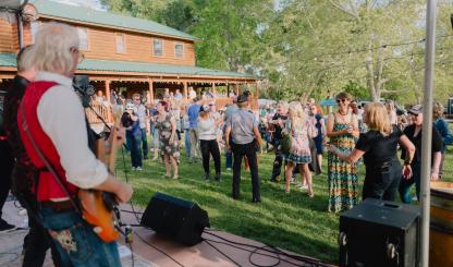 Revelers enjoy live music at a wine tasting event