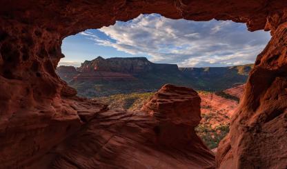 A sandstone cave near Schnebly Hill Road frames a panorama of Red Rock Country. By Chirag Patel