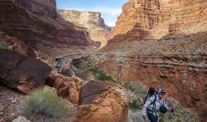 On the fifth day of the trip, author Kevin Fedarko (left) and photographer Pete McBride traverse a stretch of terrain across from 29 Mile Canyon. | RICH RUDOW