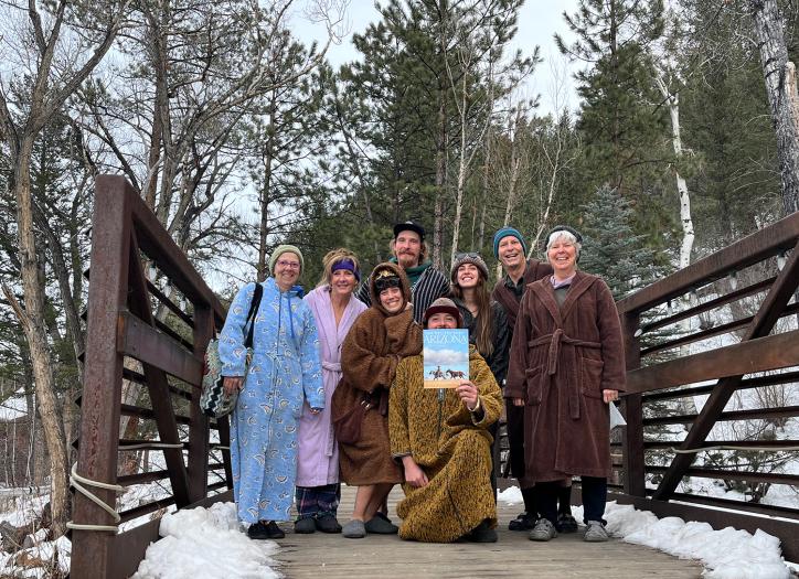 Global Snapshot at the Mt. Princeton Ht Springs Resort of 8 people posing with the November 2024 issue of Arizona Highways