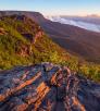 Morning light hits the eastern slopes of Mingus Mountain as fog lingers in the Verde Valley below. | Joel Hazelton