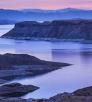 A dirt road winds toward Gregg's Hideout, a remote bay on Lake Mead, at sunset. | Larry Lindahl