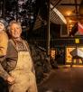 Two boatbuilders in front of their shop