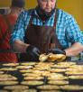 Christopher Hudson demonstrates the fine art of tortilla making by Jeff Kida