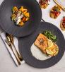 Plates of food and appetizers at Teatro. Photograph by John Burcham.