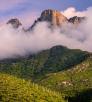  Low-hanging storm clouds cloak the cliffs of the Pusch Ridge Wilderness in the Santa Catalina Mountains, near Tucson.  By Jack Dykinga
