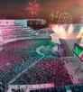 A brightly colored rendering depicts a massive amphitheater with a flame pit, fireworks and bright lights