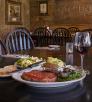 Prime rib, baked potato, salad and all the fixins' plus a glass of red wine at Molly Butler Lodge and Restaurant. By John Burcham