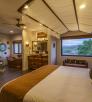 Interior of room at Origins B&B, showing bath, vanity and sleeping areas. By Laurence Parent