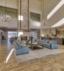 The lobby of Taawaki Inn features an open design with high ceilings and is decorated with traditional artwork.