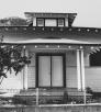 The front of the two-story Bisbee Woman’s Club’s clubhouse, dedicated in 1902, is shown behind a low wire fence. Courtesy NATIONAL PARK SERVICE