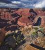 A dramatic view of Horseshoe Bend from the rim or Marble Canyon under cloudy skies. By Shane McDermott
