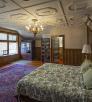 The interior of a room at Calumet & Arizona Guest House features with eclectic antique furnishings. By Steven Meckler