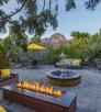 The patio area of A Sunset Chateau includes a fountain, firepit and a view of the nearby red rocks of Sedona. | Laurence Parent