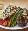 Photograph of lobster tail and steak with asparagus at The Copper Note is by Karen Shell