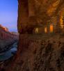 Light spills out of the Nankoweap granaries as the moon rises over the Colorado River at the Grand Canyon. | Adam Schallau