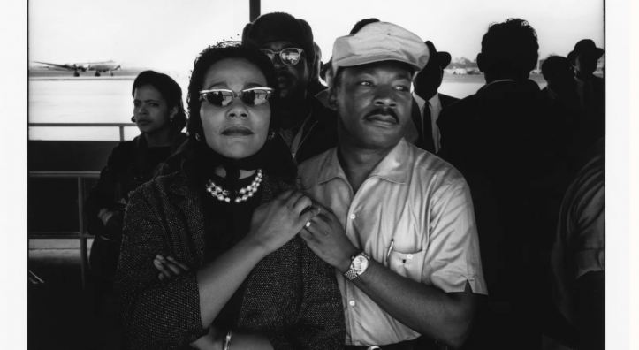 A black and white image depicts Coretta Scott King and Martin Luther King Jr.
