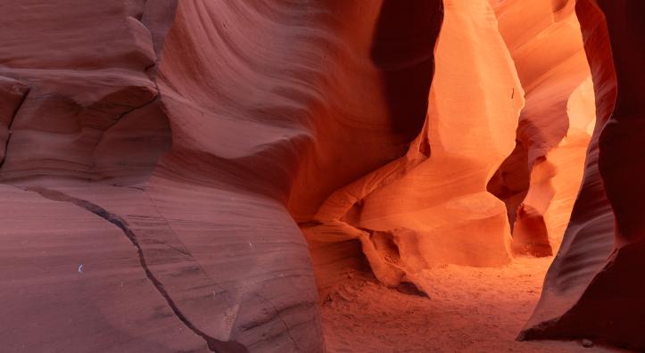 A color photographs show the intricate sandstone geology of Antelope Canyon, a slot canyon in Northeastern Arizona. 