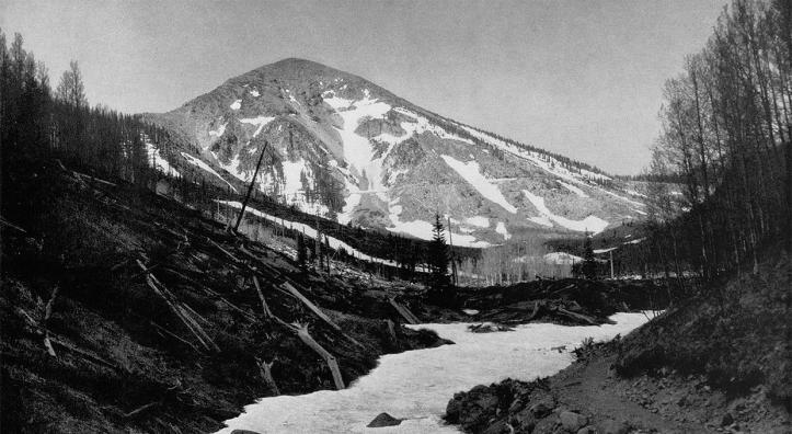 Snow covers a streambed in the Inner Basin of the San Francisco Peaks. “A pipeline beneath the white mantle supplies the Flagstaff reservoir,” Arizona Highways reported in 1936. By Norman G. Wallace