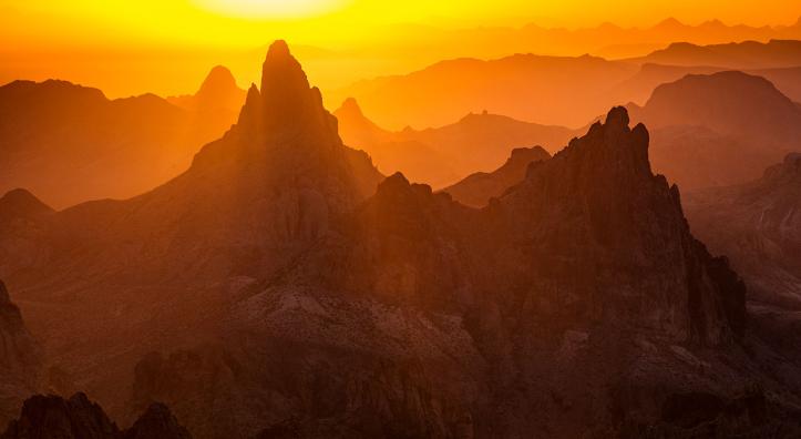 Sunrise in the Kofa Mountains displays layered hues of yellow, orange and brown. By Joel Hazelton