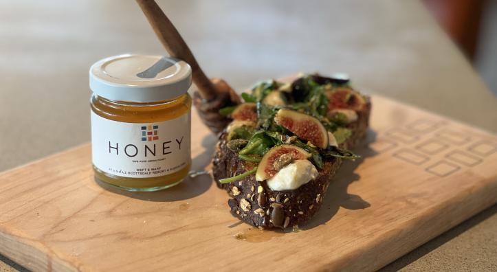 A color image shows a small jar of honey and two bite-sized snacks with fig, honey and cheese.