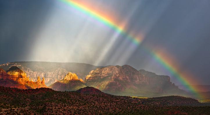 Falling rain and a rainbow bring a dreamlike vibe to a view of Red Rock Country. Such otherworldly views may be part of the reason the Sedona area has become a destination for those seeking paranormal experiences. | Guy Schmickle
