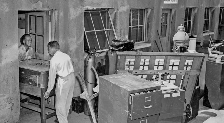 Raymond Carlson (left) helps move furniture from our first office.