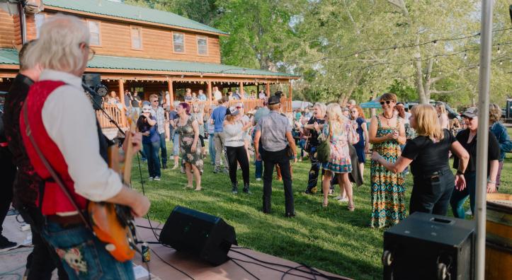 Revelers enjoy live music at a wine tasting event