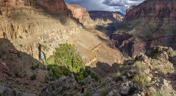 Thunder River Falls pours from an opening in a steep cliff in the Grand Canyon. From here, the Thunder River — referred to in this story as Thunder Creek — flows for only half a mile to its intersection with Tapeats Creek, making it one of the world’s shortest rivers. By Rich Rudow