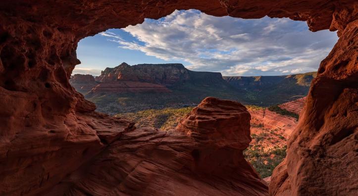 A sandstone cave near Schnebly Hill Road frames a panorama of Red Rock Country. By Chirag Patel