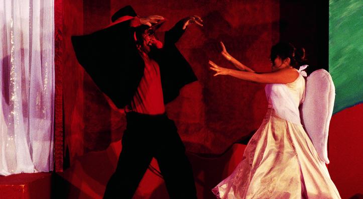 Good triumphs over evil in Guadalupe's humorous morality play La Pastorela. Here, Zarco Guerrero's Satan tangles with the Archangel Michael as portrayed by Rose Villa. | Jeff Kida