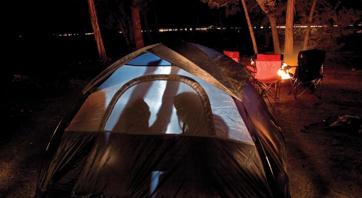 Four Canyon novices huddle inside their tent during a cold night at Mather Campground on the Grand Canyon’s South Rim. By Peter Schwepker