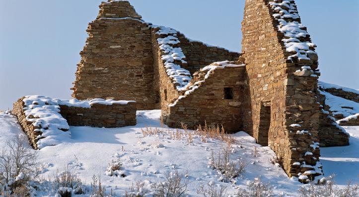 Draped in a layer of snow, Pueblo del Arroyo’s massive stone walls stand deserted in Chaco Culture National Historical Park, New Mexico. Early Southwestern dwellers left behind many clues that help historians understand ancient cultures. | George H.H. Huey