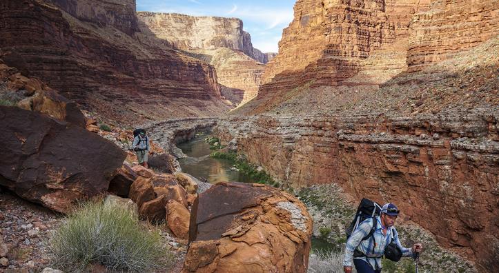 On the fifth day of the trip, author Kevin Fedarko (left) and photographer Pete McBride traverse a stretch of terrain across from 29 Mile Canyon. | RICH RUDOW